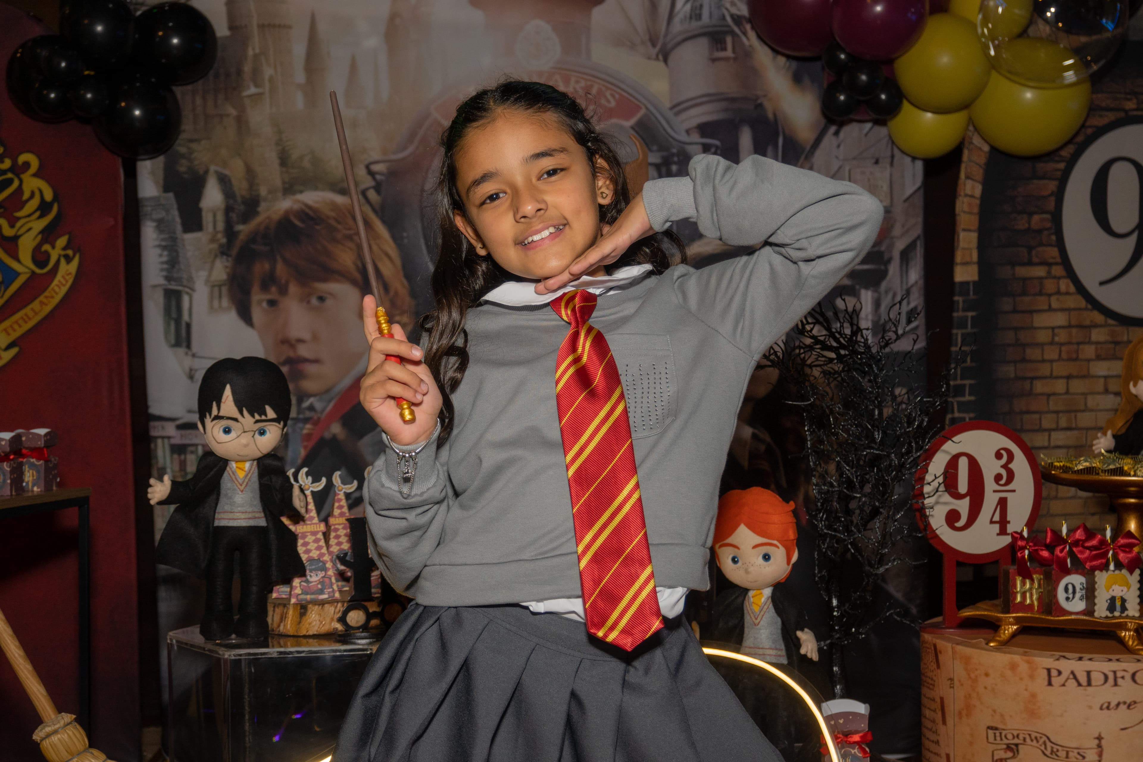 Momento especial do bolo de aniversário temático de Hogwarts